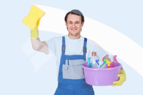 Local cleaner treating stains on a lounge sofa in Kingston