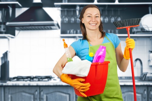Cleaner wiping kitchen surfaces during a Kingston domestic cleaning visit