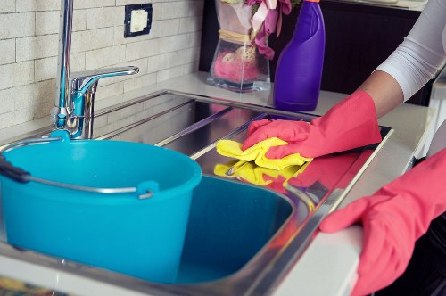Cleaner preparing a bathroom clean in a Kingston property